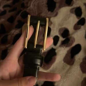 Black belt with gold buckle